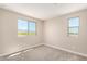 Cozy bedroom with plush carpet, sunny window view, and neutral color palette at 15622 S 181St Dr, Goodyear, AZ 85338