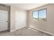 Comfortable bedroom with sliding closet door, plush carpet, and neutral color scheme at 15622 S 181St Dr, Goodyear, AZ 85338