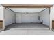 Spacious, bright garage with neutral walls, concrete flooring, and an insulated garage door at 15622 S 181St Dr, Goodyear, AZ 85338