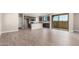 Open-concept kitchen with dark wood cabinets, granite countertops, stainless appliances, and a sliding glass door at 15622 S 181St Dr, Goodyear, AZ 85338