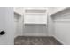 Spacious walk-in closet featuring custom shelving and ample storage space at 15622 S 181St Dr, Goodyear, AZ 85338