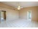Spacious bedroom featuring tile flooring, ceiling fan and neutral paint at 1668 E Melissa St, Casa Grande, AZ 85122