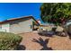 Picturesque backyard showcasing a covered patio with seating, providing a relaxing outdoor space with lush foliage and shade at 3269 E San Remo Ave, Gilbert, AZ 85234