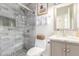Elegant bathroom with a glass-enclosed shower showcasing stylish tile work and modern fixtures over a granite vanity at 3269 E San Remo Ave, Gilbert, AZ 85234