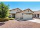 Charming single-story home with a well-maintained front yard and a two-car garage at 3269 E San Remo Ave, Gilbert, AZ 85234