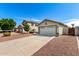 View of two homes showcasing driveways and attached two-car garages at 3269 E San Remo Ave, Gilbert, AZ 85234