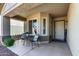 Inviting front porch with seating and a welcoming entrance at 3269 E San Remo Ave, Gilbert, AZ 85234