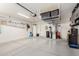 Well-maintained garage featuring clean epoxy floors, overhead storage, and organized spaces for tools and equipment at 3269 E San Remo Ave, Gilbert, AZ 85234