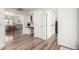 Entryway showcasing built-in desk, storage, and light wood floors flowing into other living spaces at 3269 E San Remo Ave, Gilbert, AZ 85234