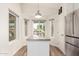 Bright kitchen nook with windows and island, providing ample natural light and space at 3269 E San Remo Ave, Gilbert, AZ 85234