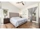 Serene main bedroom featuring a tall upholstered headboard, ensuite bath, and a soothing atmosphere at 3269 E San Remo Ave, Gilbert, AZ 85234