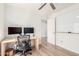 Bright office space features wood floors, ceiling fan, and convenient whiteboard for creative work at 3269 E San Remo Ave, Gilbert, AZ 85234