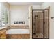 Bathroom featuring a tub and shower at 6409 N 11Th Dr, Phoenix, AZ 85013