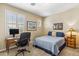 Bedroom with a desk and comfortable bed at 6409 N 11Th Dr, Phoenix, AZ 85013