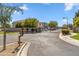Gated community entrance with well-maintained landscaping and a secure entry point for residents at 6409 N 11Th Dr, Phoenix, AZ 85013