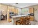 Well-appointed kitchen featuring counter seating, stainless steel appliances, and ample natural light, a functional culinary space at 6409 N 11Th Dr, Phoenix, AZ 85013
