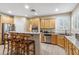 Bright kitchen features stainless steel appliances, breakfast bar, and tile flooring at 6409 N 11Th Dr, Phoenix, AZ 85013