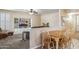 Living room and dining area with built-in shelving and neutral color palette at 6409 N 11Th Dr, Phoenix, AZ 85013