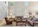 Bright living room featuring high ceilings, plantation shutters, and stylish furnishings, a relaxing and inviting space at 6409 N 11Th Dr, Phoenix, AZ 85013
