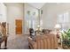 Stylish living room with soaring ceilings, large windows, and a cozy seating area, offering a comfortable retreat at 6409 N 11Th Dr, Phoenix, AZ 85013