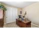Office with a desk and sliding closet doors at 6409 N 11Th Dr, Phoenix, AZ 85013