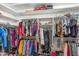 Organized walk-in closet providing ample storage space for clothing and shoes at 6409 N 11Th Dr, Phoenix, AZ 85013