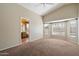 Spacious bedroom with multiple windows, a view to the pool area, and an ensuite bathroom at 1024 N Ithica Ct, Chandler, AZ 85225