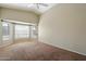 A spacious and well-lit bedroom with a vaulted ceiling and a large window bay at 1024 N Ithica Ct, Chandler, AZ 85225