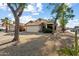 Charming single-story home featuring desert landscaping and a spacious two-car garage at 1024 N Ithica Ct, Chandler, AZ 85225