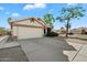 This single-story home features a two-car garage and low maintenance landscaping at 1024 N Ithica Ct, Chandler, AZ 85225