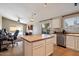 Modern kitchen with an island, stainless steel appliances, and an eat-in area at 1024 N Ithica Ct, Chandler, AZ 85225