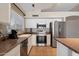 Bright kitchen featuring stainless steel appliances, white cabinets, and a window at 1024 N Ithica Ct, Chandler, AZ 85225