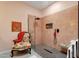 Modern bathroom featuring a stylish glass shower, a decorative chair and clean design at 10591 E Saddlehorn Dr, Scottsdale, AZ 85258
