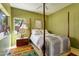 Inviting bedroom with a four-poster bed, soft lighting, and a colorful area rug providing comfort at 10591 E Saddlehorn Dr, Scottsdale, AZ 85258