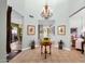 Grand foyer featuring high ceilings, stylish chandelier, and elegant tile flooring at 10591 E Saddlehorn Dr, Scottsdale, AZ 85258