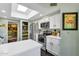 Modern kitchen with stainless steel appliances, white cabinets, and a center island at 10591 E Saddlehorn Dr, Scottsdale, AZ 85258