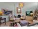 Cozy living room with a modern fireplace, stylish mirror, and decorative accents at 10591 E Saddlehorn Dr, Scottsdale, AZ 85258