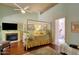 Stylish primary bedroom featuring a fireplace, a four poster bed, and bathroom access at 10591 E Saddlehorn Dr, Scottsdale, AZ 85258