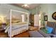 Bright, open bedroom with a four poster bed, soft colors and lots of natural light at 10591 E Saddlehorn Dr, Scottsdale, AZ 85258