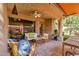 Charming covered patio with comfortable seating, a ceiling fan, and a serene view of the outdoors at 10591 E Saddlehorn Dr, Scottsdale, AZ 85258