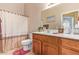 Well-lit bathroom with a vanity and shower, offering a clean and functional space at 10861 E Olla Ave, Mesa, AZ 85212