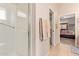 Clean and modern bathroom with a walk-in shower, neutral colors, and well-placed towel racks for convenience at 10861 E Olla Ave, Mesa, AZ 85212