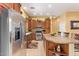 Spacious kitchen featuring stainless steel appliances and a large center island for food preparation and dining at 10861 E Olla Ave, Mesa, AZ 85212