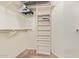 This walk-in closet boasts built-in shelving for optimal organization and maximized storage at 10861 E Olla Ave, Mesa, AZ 85212