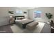 Serene bedroom with neutral colors, large window, and stylish furnishings at 1173 N 13Th St, Coolidge, AZ 85128