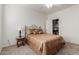 Bedroom with a ceiling fan, large bed, side table, and closet at 1194 E Coyote Creek Way, San Tan Valley, AZ 85143