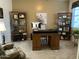 Home office with large desk and shelving units at 1194 E Coyote Creek Way, San Tan Valley, AZ 85143