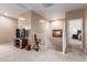 Open loft area with carpet, a tv console, and staircase views at 1194 E Coyote Creek Way, San Tan Valley, AZ 85143