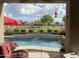 Beautiful pool area, complete with a fountain and elegant landscaping at 1194 E Coyote Creek Way, San Tan Valley, AZ 85143