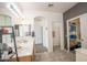 Bathroom with double sinks, an arched entryway, and a closet that is filled at 14091 W Bloomfield Rd, Surprise, AZ 85379